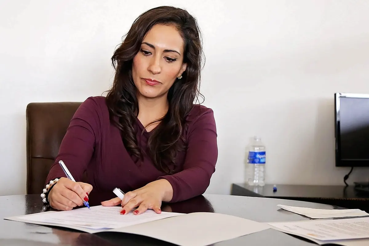 A small business leader reviewing workplace policy documents
